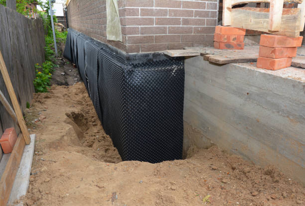 SJ Waterproofing Pros technician performing targeted Vapor Barrier Installation assessment in Stone Park, IL